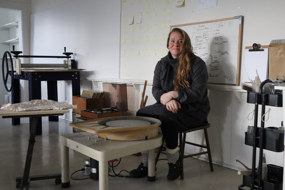 Valerie Belisle at one of her pottery wheels, where clay is shaped — perfect for a reenactment from Ghost, says Belisle. 