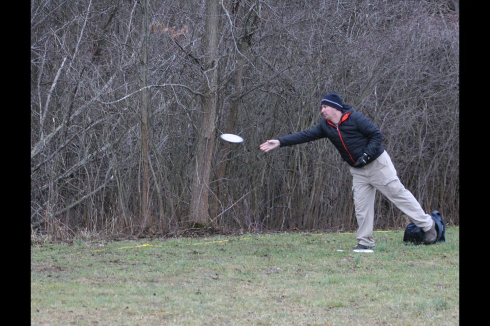 Jeff Marchese goes after the basket on hole number 8 at the NOTL Disc Golf tournament Saturday, Jan. 7.