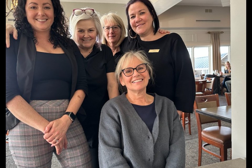 Bobbi Wanamaker, Brenda Breen, Kathy Allen, Lisa Ermanson, dining room staff, with Eva Reif (seated), love working in the fun family atmosphere of the club. (Penny Coles)