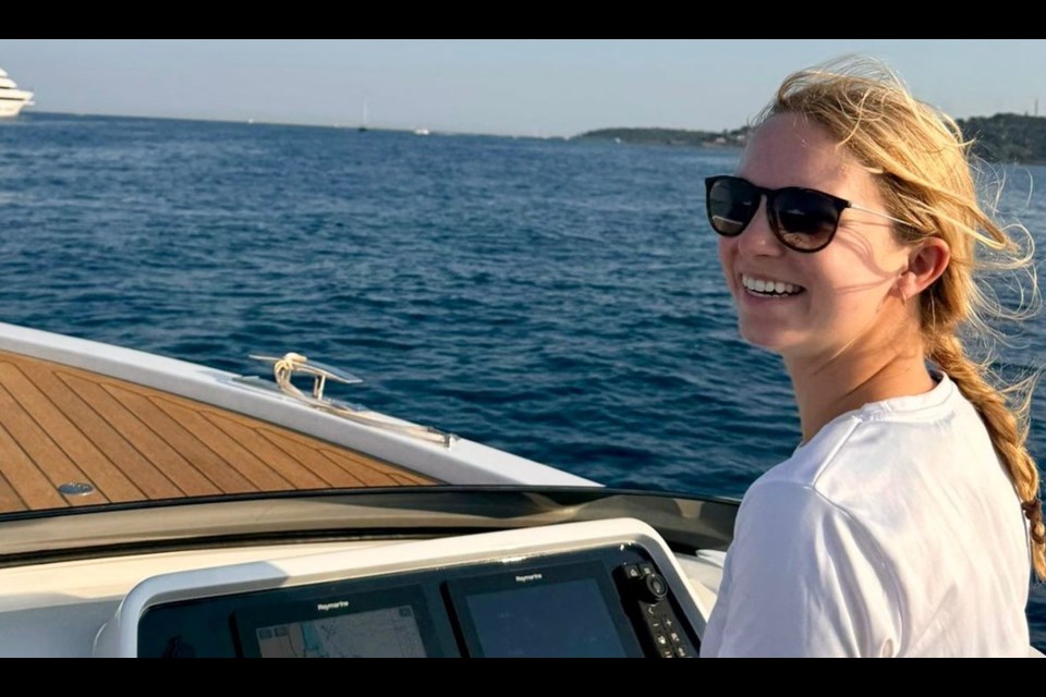 Abbie Gowans at the helm of a tender. 