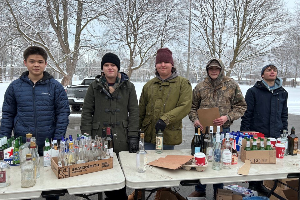 Warrant Officer Second Class Aiden Deane, Officer Cadet Dante Bell, Flight Sergeant Enzo Cocetti, Cpl. Preston Bowslaugh and Cadet Julian Catinari collect bottles and cans at the NOTL Canadian Royal Legion on King Street in Old Town. | Sharon Burns