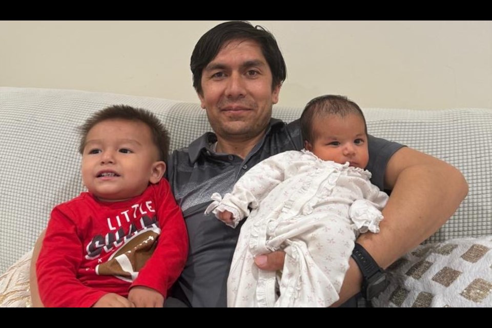 This year, the Kazemi family will lead the Candlelight Stroll. Here, Asadullah poses with son Ali and Daughter Zahra. 