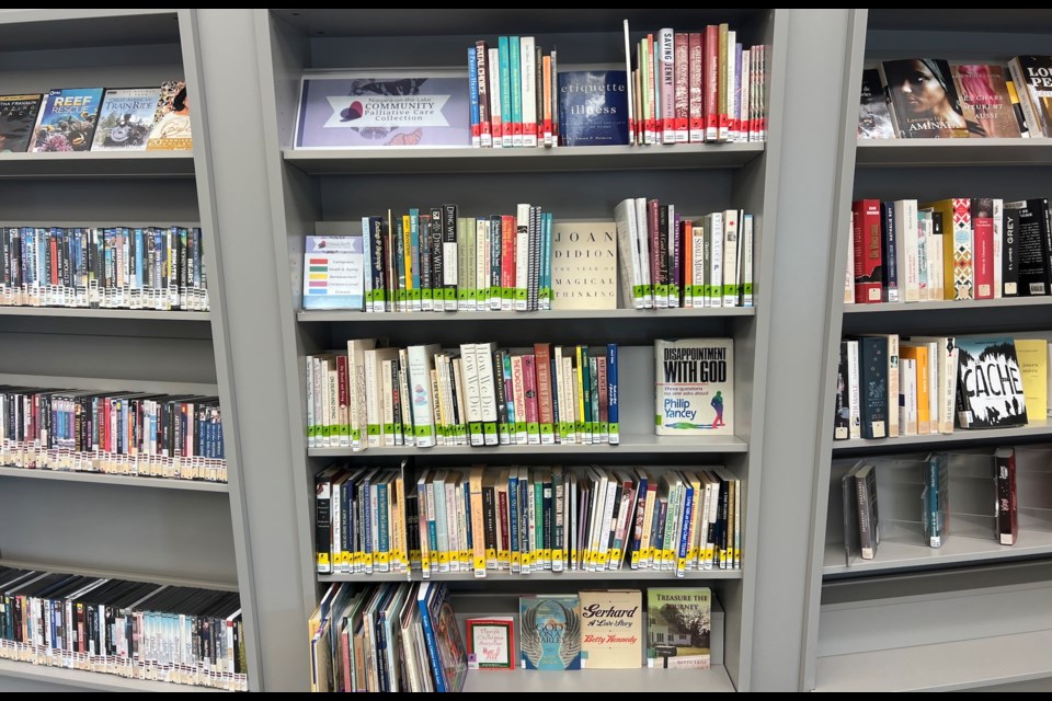 The middle stack of books have been donated to the NOTL Library by NOTL Community Palliative Care so community members may have easier access to them. | Sharon Burns
