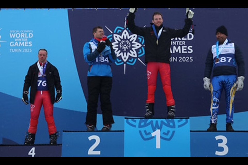 Team Canada's Carter Simpson (L) captured fourth today in the Giant Slalom at the Special Olympics World Winter Games in Italy. 