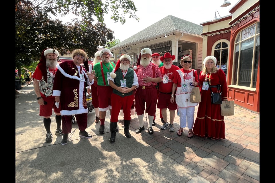 The World Santa Claus Congress paid a visit to Niagara-on-the-Lake Wednesday, a trip organized by Peter Boxall Jr. (centre, green vest)