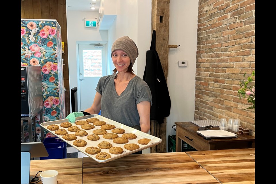 Catherine McGregor shows off a tray of fresh-baked cookies