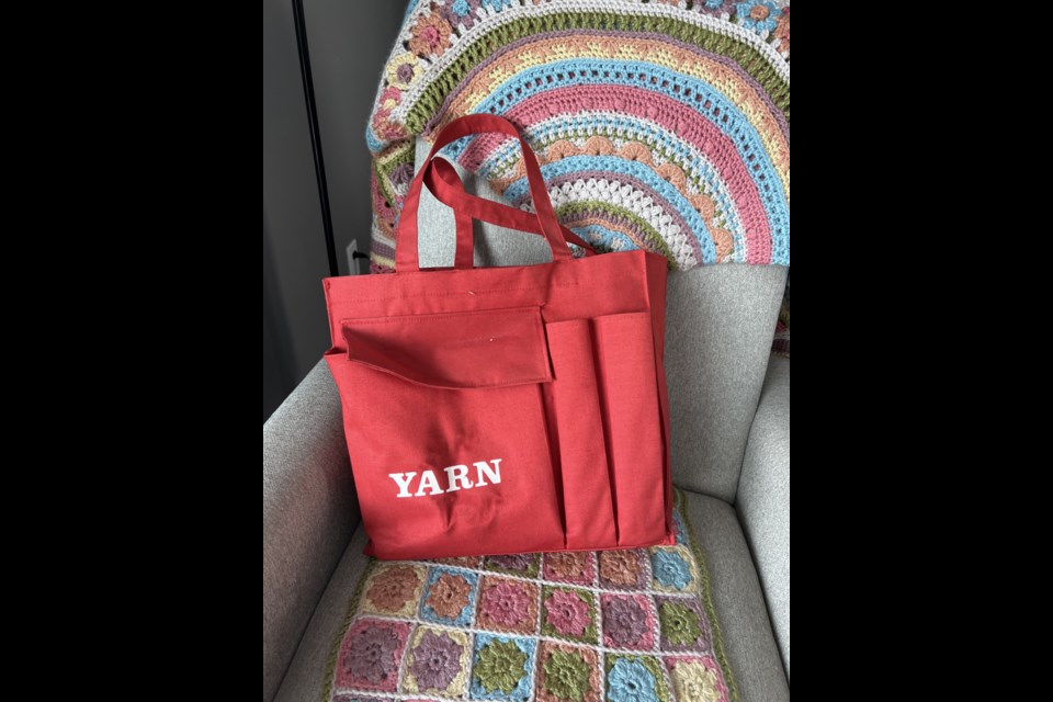 The red tote bag that started author Sharon Burns ruminating on the lessons learned from crochet.