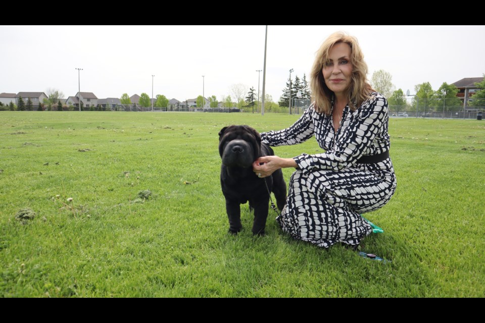 Rhonda Holloway and 8-Ball in the Virgil Sports Park. 
