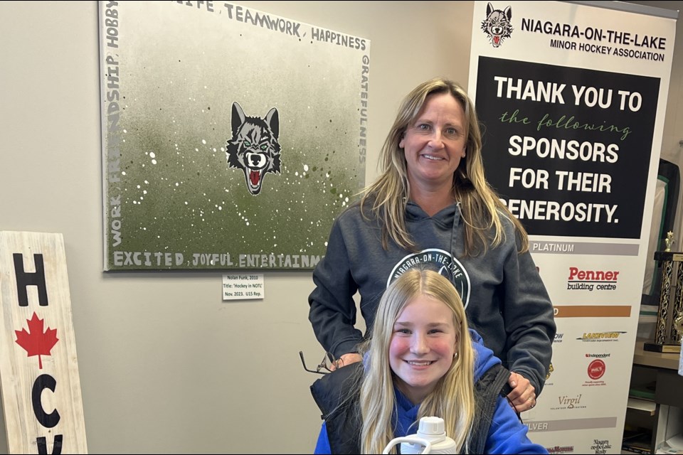 Ella Cwiertniewski, front, with Wolves secretary Carrie Plaskett