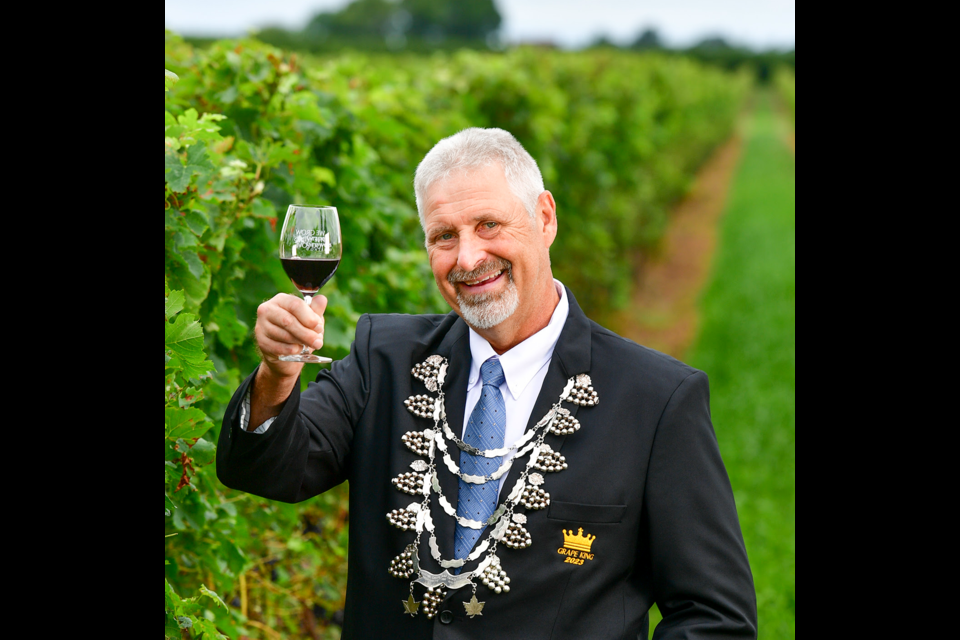 Cheers to a great harvest: Grape King Erwin Wiens, shown in his vineyard on the day of his installation, says this year an “above-average” harvest is expected. / Denis Cahill