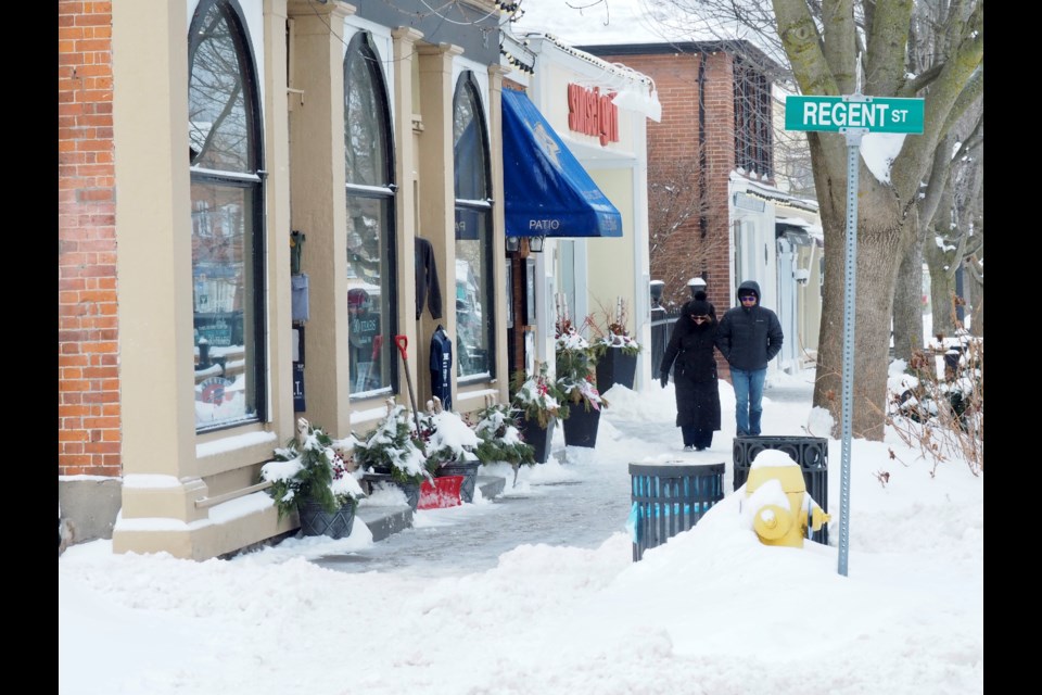 Family Day on Queen Street was cold. The wind was blowing snow off shop roofs.  The name of the game was ‘Bundle Up’ for most of those spotted. Ice Cream was being eaten though. Tourists were taking photos of each other. There were people shopping and people eating ice cream - nothing stops tourists rom eating ice cream in NOTL! Many were quickly entering the businesses that were open to get a reprieve from the cold before venturing back out. Our snow plow operators were circulating keeping the streets in good condition.