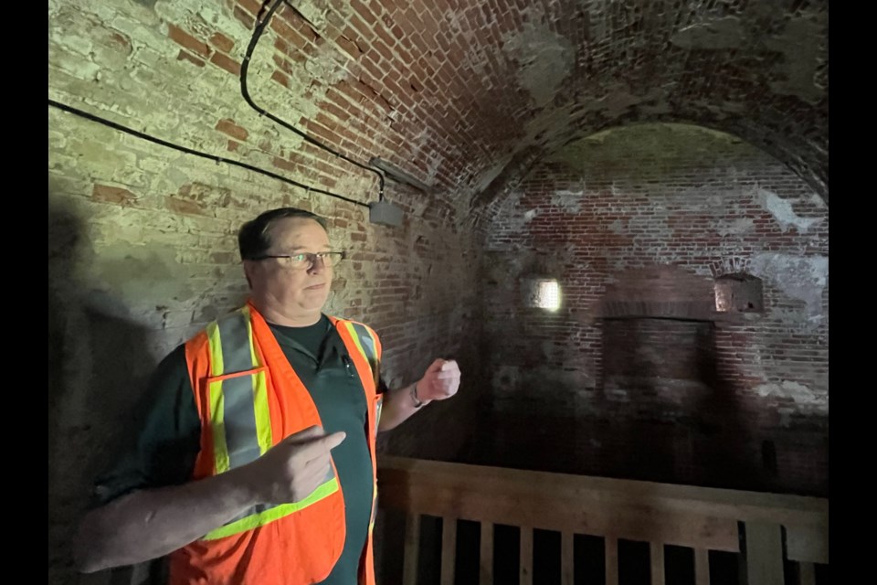 Chris Zoetewey points to the features inside the fort, including walls two feet thick.