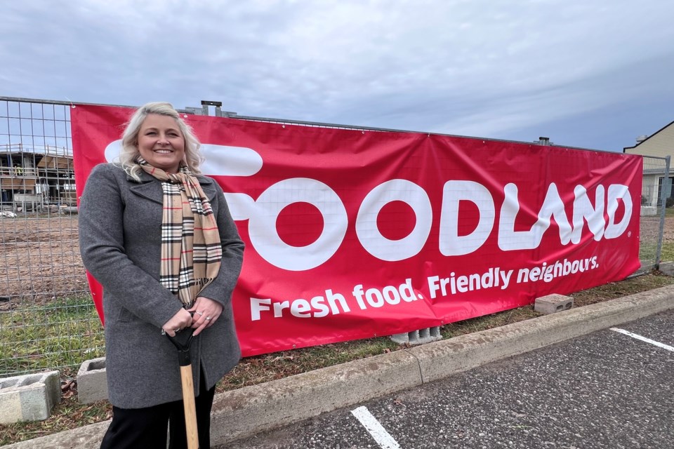 Foodland franchise owner Lindsey Bridgeman poses with her ceremonial shovel at the
construction site on Tuesday.