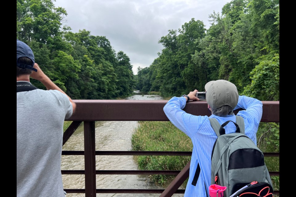 Jakob Walløe Hansen and Sarah Gatley, take pictures at the start of a geohike at Ball’s Falls Conservation Area.