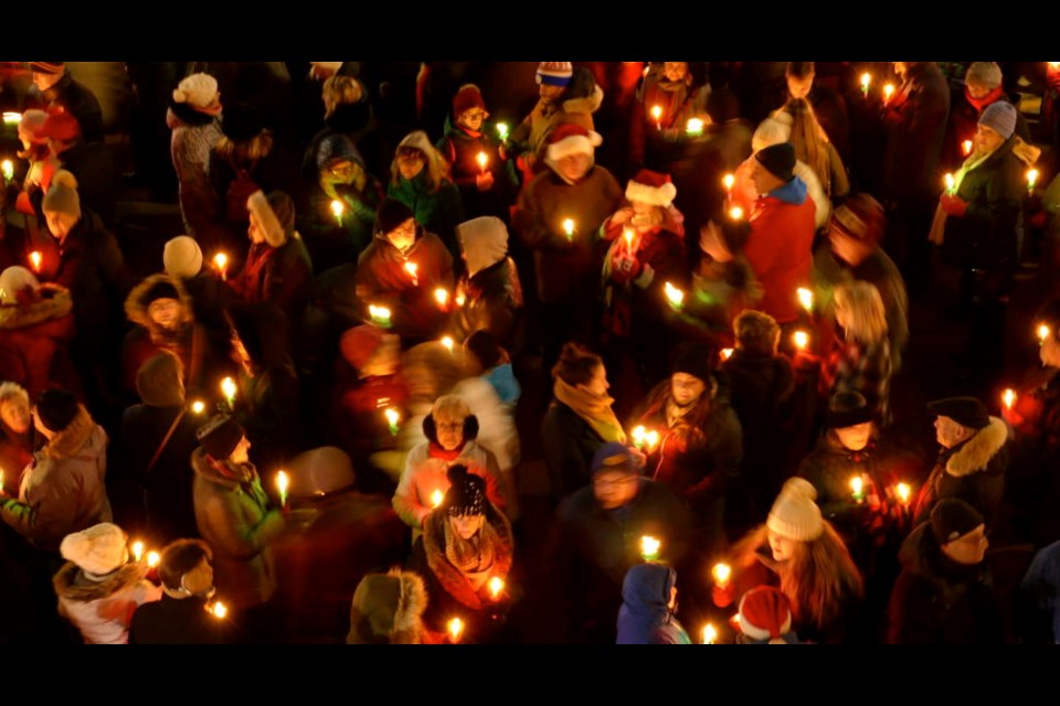 This is the scene from a previous Candlelight Stroll from the Court House steps in Niagara-on-the-Lake. This year's stroll will be both virtual, with a recorded ceremony, and live, as residents are asked to purchase and light their candles and sing a few carols outside their home. | File photo