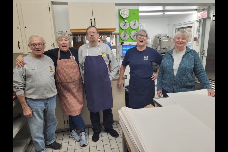 Inside the Lions Hall kitchen Rick Wills, Janet Guy, Hal Barlow, Sue Pittman and Debbie Chagnon help with fries and putting the dinners together.