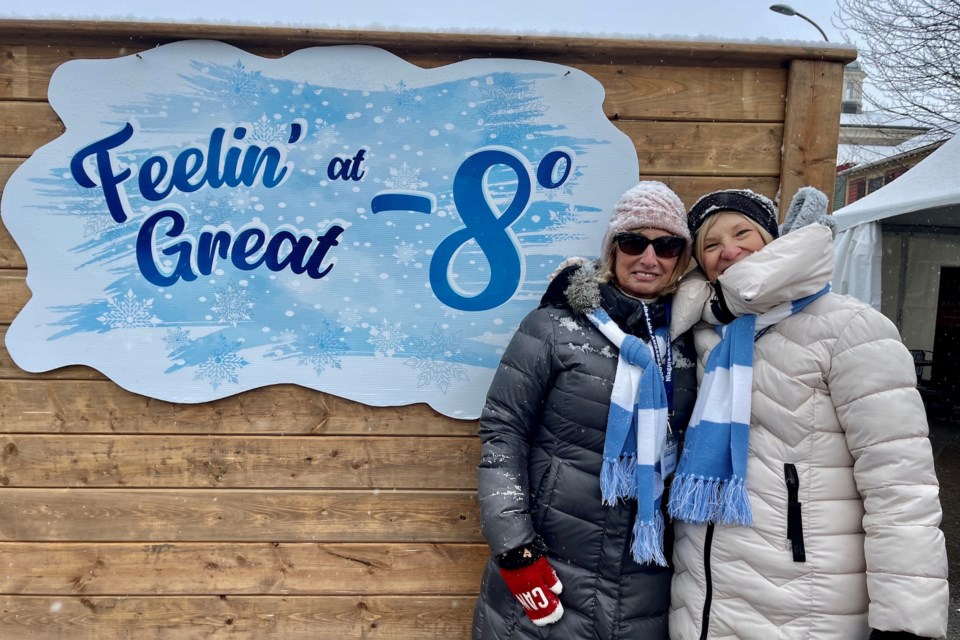 Festival volunteers and ambassadors Susan Sampson and Barb Coster are feeling great at -8 degrees at NOTL's Icewine Festival on Queen Street.