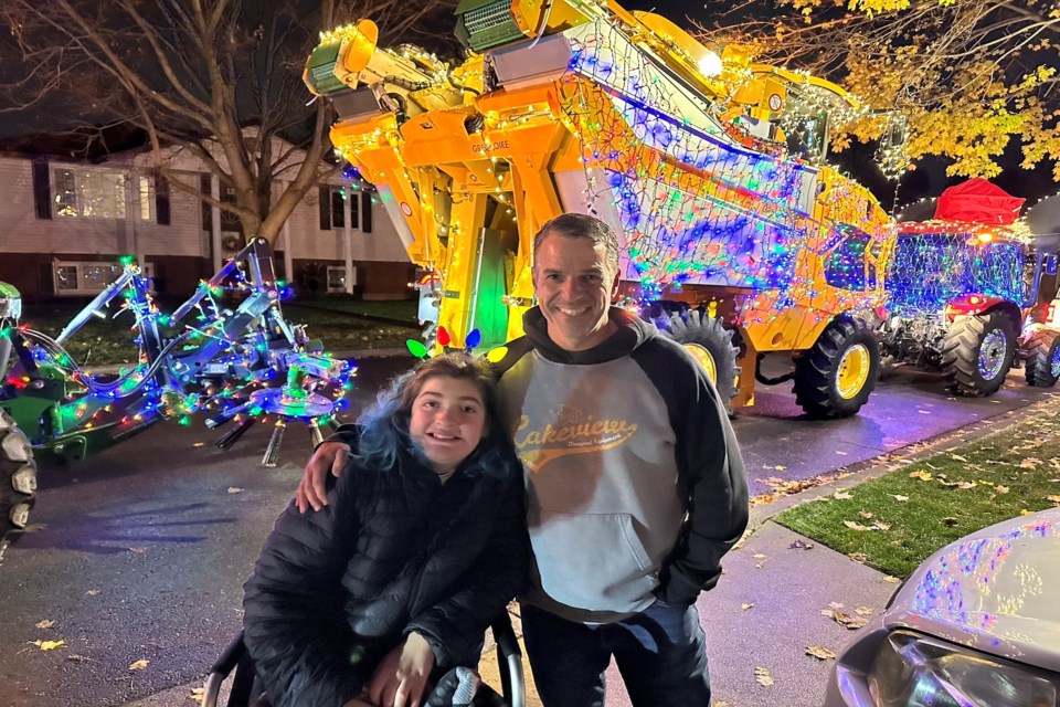 Joe Pillitteri and Megan Dyck in front of the Dyck's home after it was decorated.