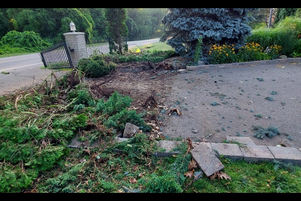 Gardens, gates and a fence were destroyed in the wake of the car’s trajectory.