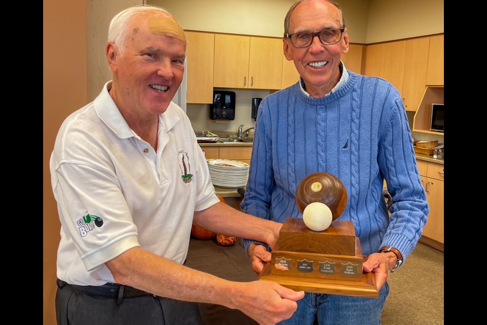 Paul McHoull  presenting Good Sportsmanship award to Vic Klassen.
