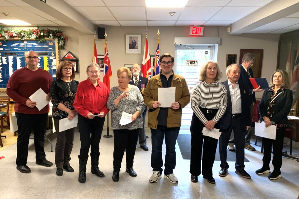 Darryl Taillefer, Christine Parkinson, Carol Hepburn, Margaret McGilvray, Daniel Baldinelli, Rebecca Lemaich, Michael Albanese and Anita Albanese became members of the legion on New Year's Day. In the background are long-time members Al Howse and Doug Pettit.