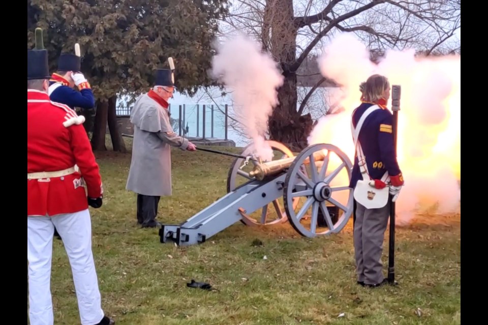 Honorary cannoneer Tony Chisholm (in grey), assisted by Parks Canada’s Dan Laroche, Thomas Forsyth and Peter Mitchel, lights the cannon for a ceremonial firing across the Niagara River from the grounds of Navy Hall. It’s a time-honoured tradition of the annual New Year’s Levee. 