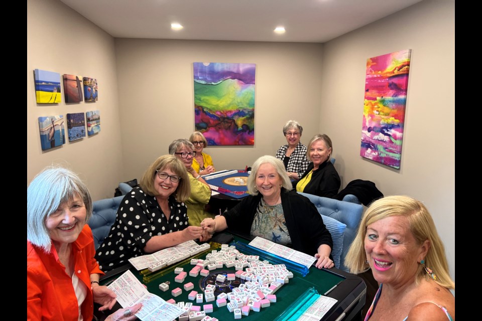 Val Tessis, Tobi Brockway, Trish Spagnol, Sandra Davis, Charmian
Entine, Lynn Roselli, Laurie Gayadeen and Penny Milligan playing mahjong.