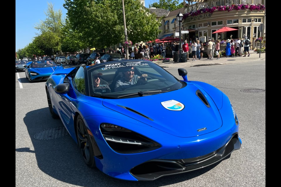 Lord Mayor Gary Zalepa leads a parade of McLarens along Queen Street.