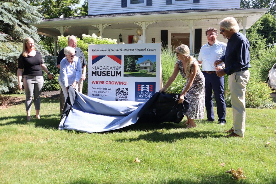 Dropping the shroud to officially add the Carnochan house to the museum L-R: Sarah Kaufman, Geoffrey Joyner, Lorraine Joyner, Lauren Goettler, Lord Mayor Gary Zalepa, Vaughn Goettler.