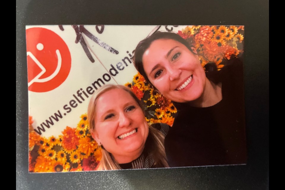 Sarah Kaufman and Shawna Butts display the art of the selfie.
