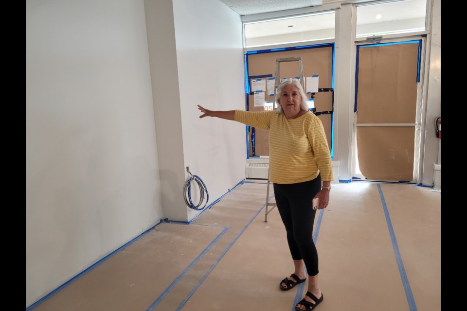 Cindy Grant can envision what the new space will look like, including the spot on the newly painted wall where she will hang the donors’ plaque.