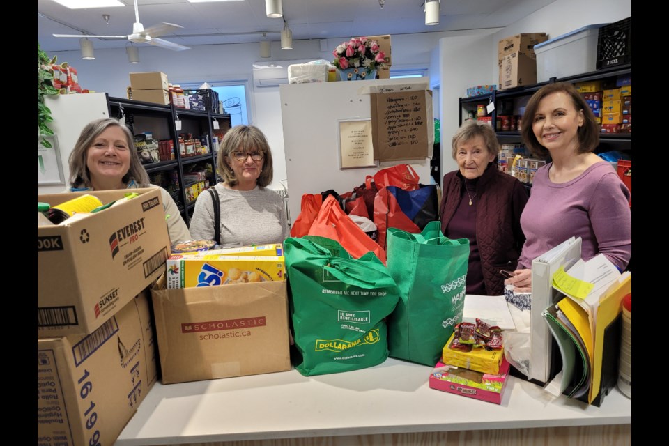 Krista Millar, Maria Townsley, Marion Ollerhead and Linda Andres show off food collected and delivered by St. Davids Public School this week.