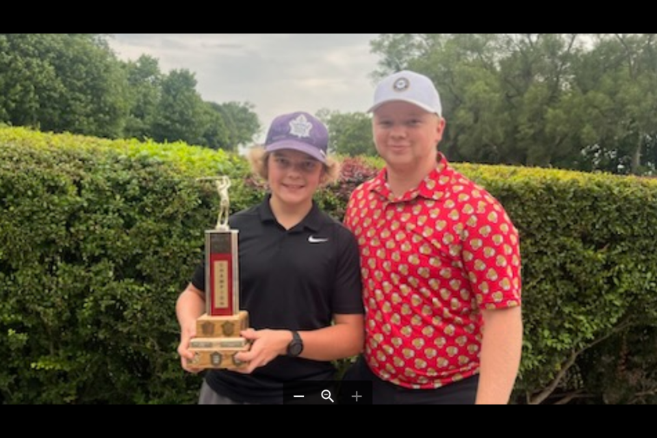 Bantam Boys (U15) champion for the second straight year, Gavin Tomsczuk, with Owen Howells, NOTL Golf Club assistant pro