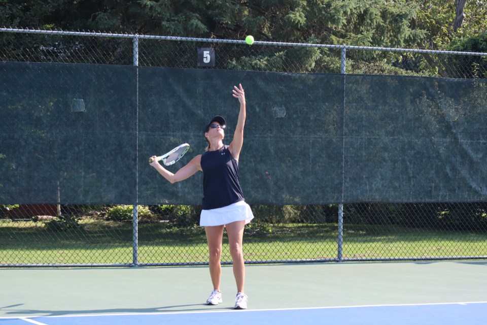 Charlene Juras sets up her serve.