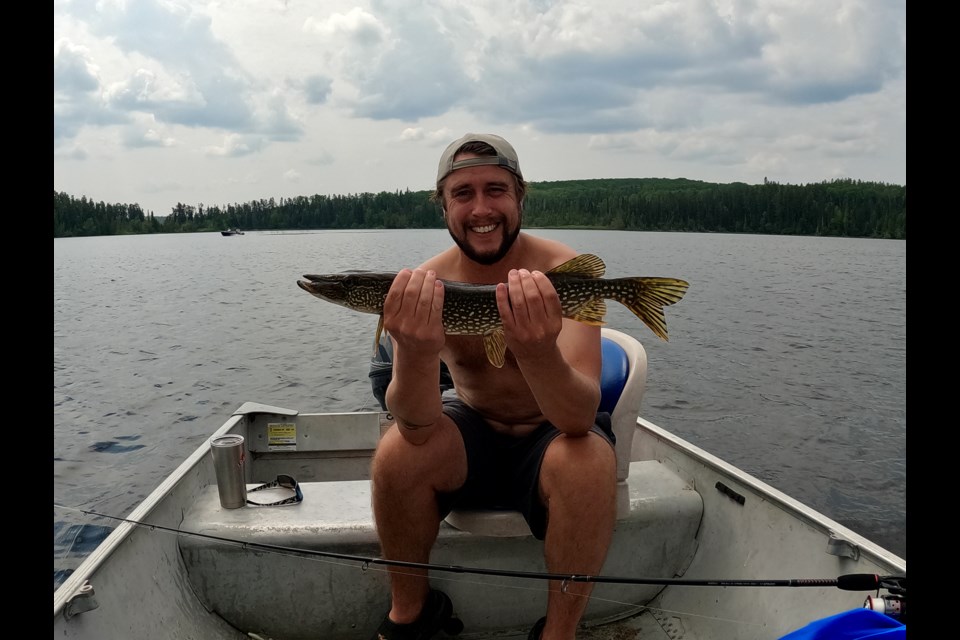 Myself with a northern pike- nothing special in size, but a beautiful looking fish.