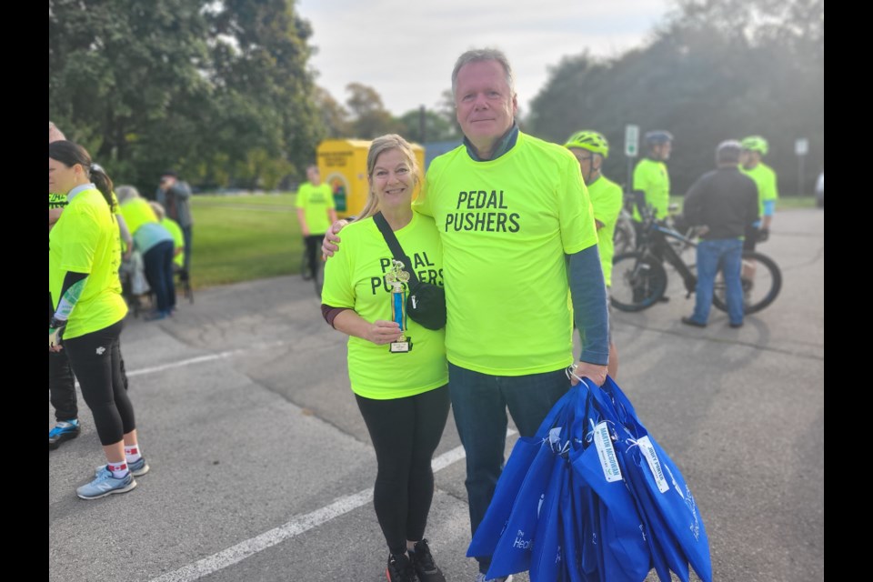 NOTL Community Palliative Care Service director Bonnie Bagnulo with Ron Kassis, chair of the Healing Cycle Foundation and run. He was in NOTL to ride the 25-kilometre route, give Bagnulo a trophy for the team raising the most amount of money, and hand out grab bags to participants. 