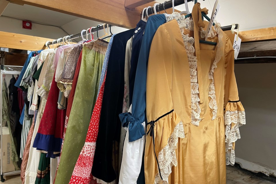 A rack of costumes at the museum ready for anyone who needs one for an event.