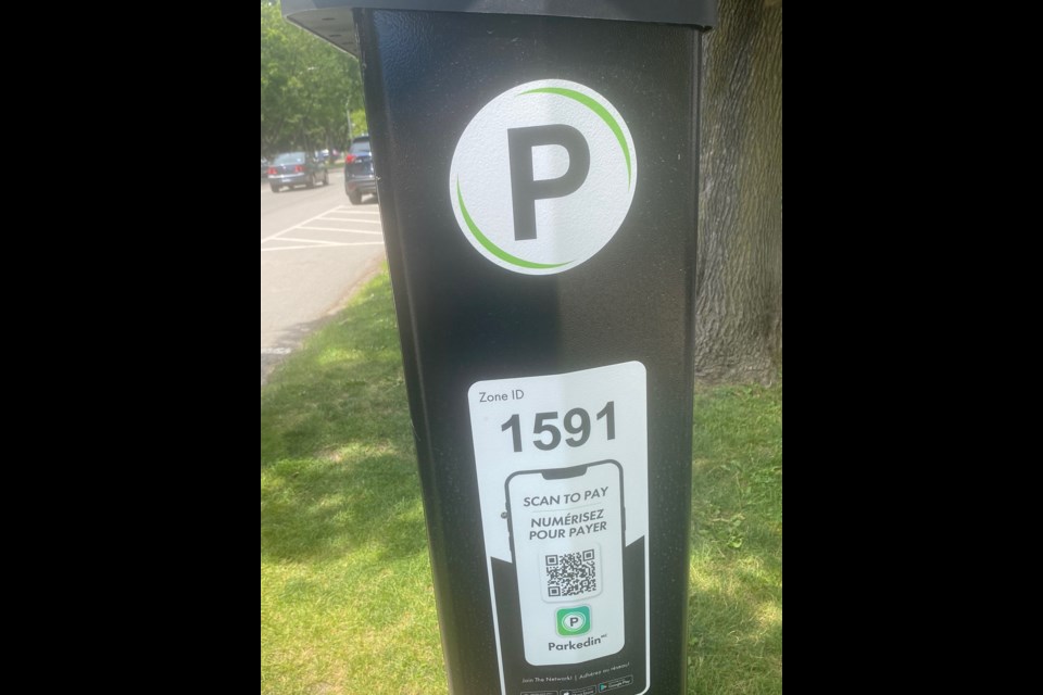 New parking meters offer options, including scanning.