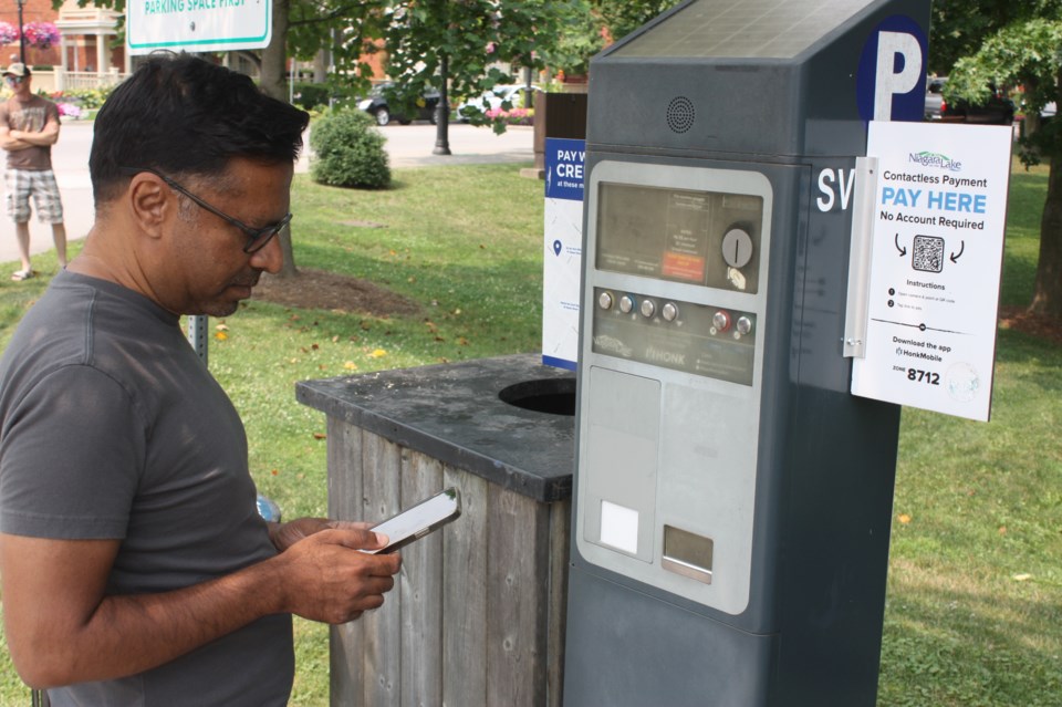 parking-metre-toronto-resident-ashley-rodriguez-downloads-the-honkmobile-app-on-his-phone-after-arriving-in-niagara-on-the-lake-monday
