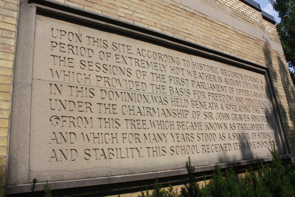 One of the committee discussions was about the accuracy of the words about a meeting of parliament mentioned on this bas relief on the wall of Parliament Oak School. 