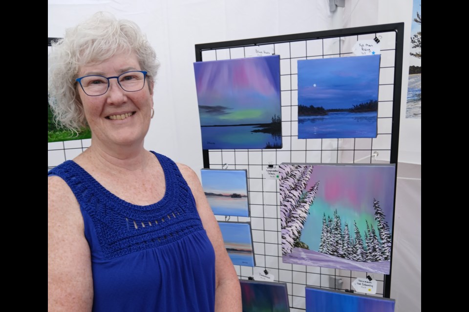 Inspired by ever-changing colours, serenity and movement, Donna Voisin finds passion to create in her surroundings. She painted the Northern Lights seen on May 10, 2024. This was her first art show. | All photos by Maria H. Klassen