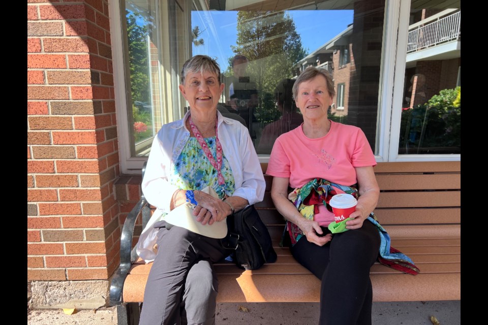 Irene Wall and Agatha Loewen enjoy a coffee before Pleasant Manor’s inaugural Terry Fox walk.