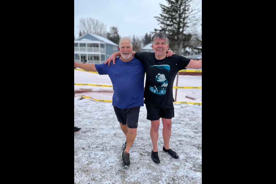 Chris Bjorgan and Rick Mills at the annual Boxing Day Penguin Swim in 2022.