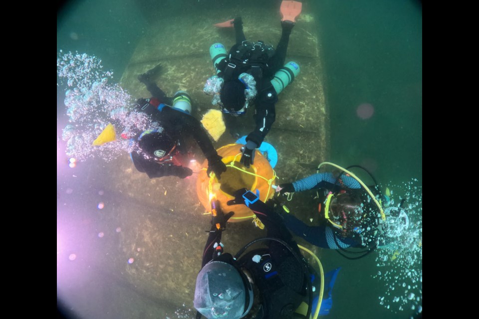 The Niagara Divers Association (NDA) held their annual pumpkin carving event on Sunday at the Welland Scuba Park. For the first time a large 80-plus pound Pumpkin was settled to the bottom on top of the wreck feature in the underwater park. Four divers carved on the sides of this pumpkin. Other divers also carved their own pumpkins during the event. This years Halloween dive honoured fellow diver, Jimmy Lockard, a member of the NDA and former NOTL resident who passed away during a dive in Brockville, Ontario recently.