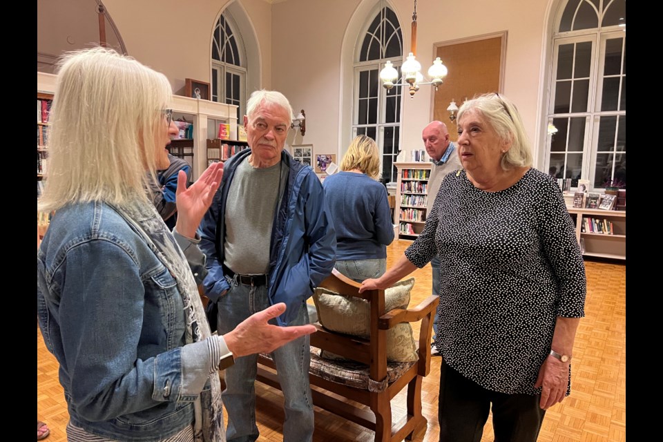 Senior Housing Options Group member Cindy Grant listens as Queenston residents react to the results of a survey on NOTL housing options.