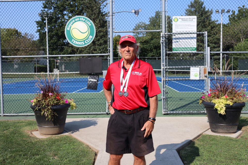 Gerald Pepe wearing his silver and bronze medals won last week at the Canada Senior Games in Quebec.