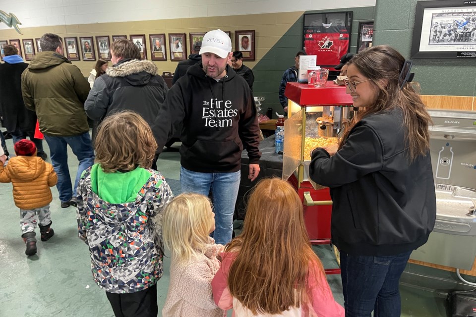 Andrew and Gabriella Perrie hand out popcorn to happy skaters taking a snack break.