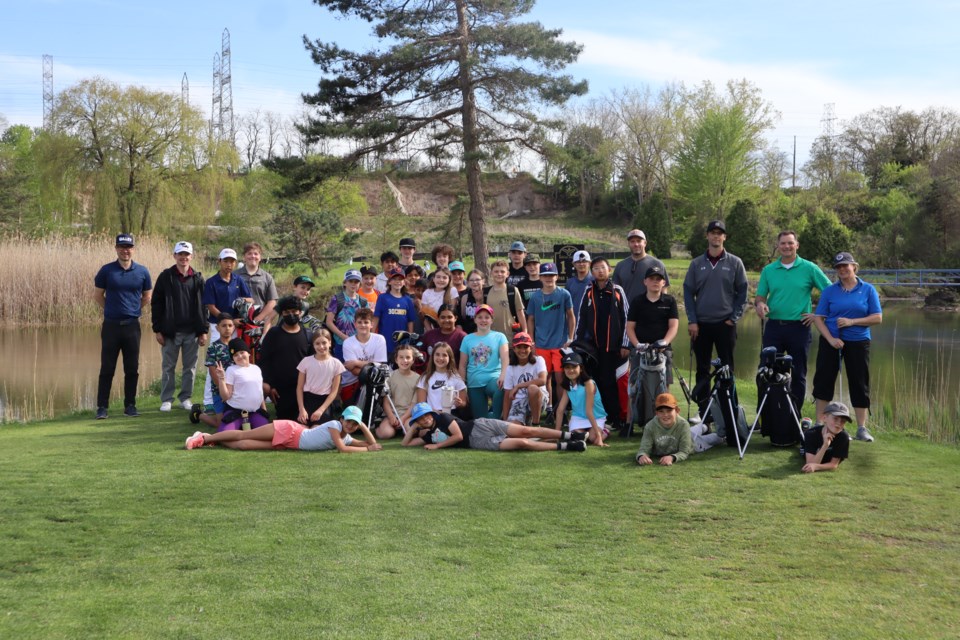 St. Davids Public School has 35 kids taking part in a six-week golf program at Eagle Valley with club pros Travis Glass (third from right) and Corey Bristowe (far left).