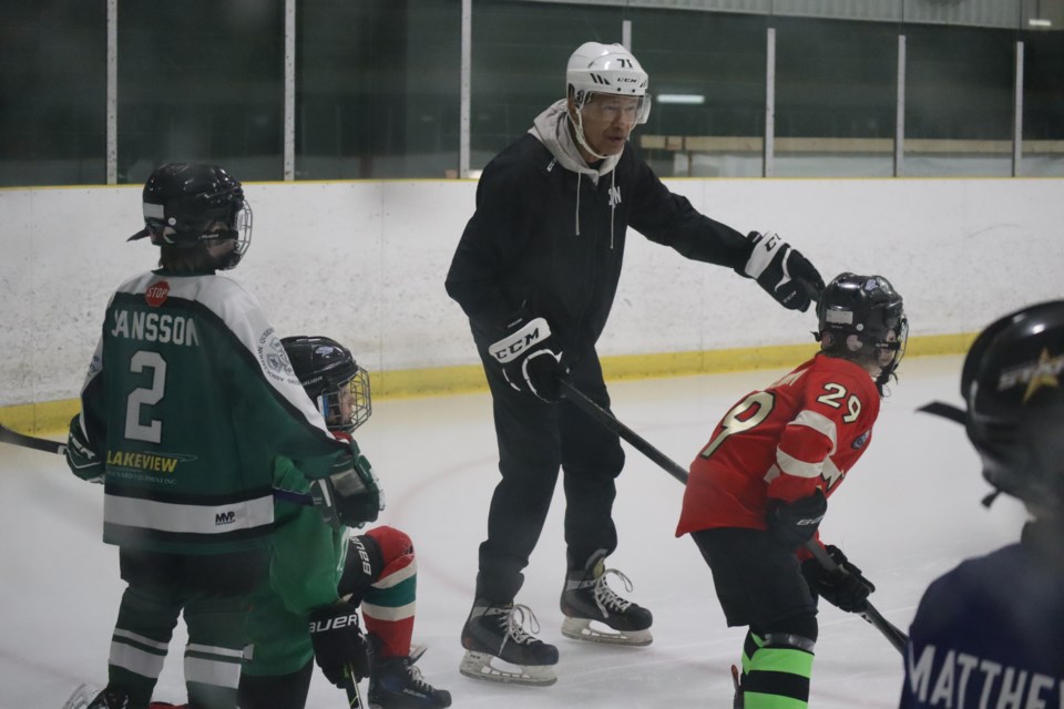 Ted Nolan giving some instruction during a warm-up drill. 