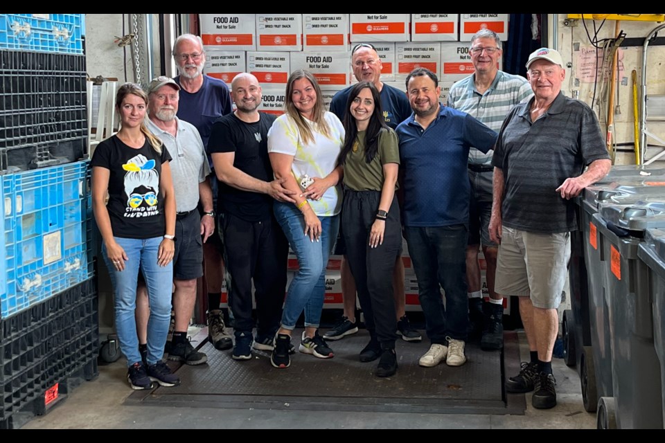 A group of volunteers finish loading every nook and cranny of a truck headed to Ukraine.